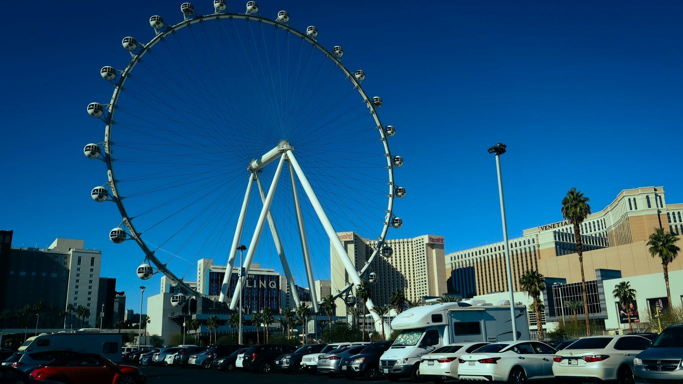 a large ferris wheel in a parking lot