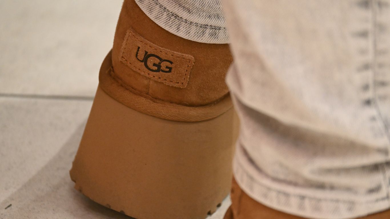 A close up of a person wearing a pair of boots