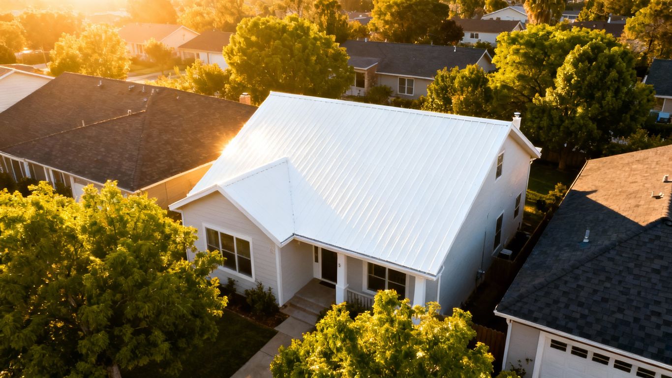 White roof reflecting sunlight on a house.