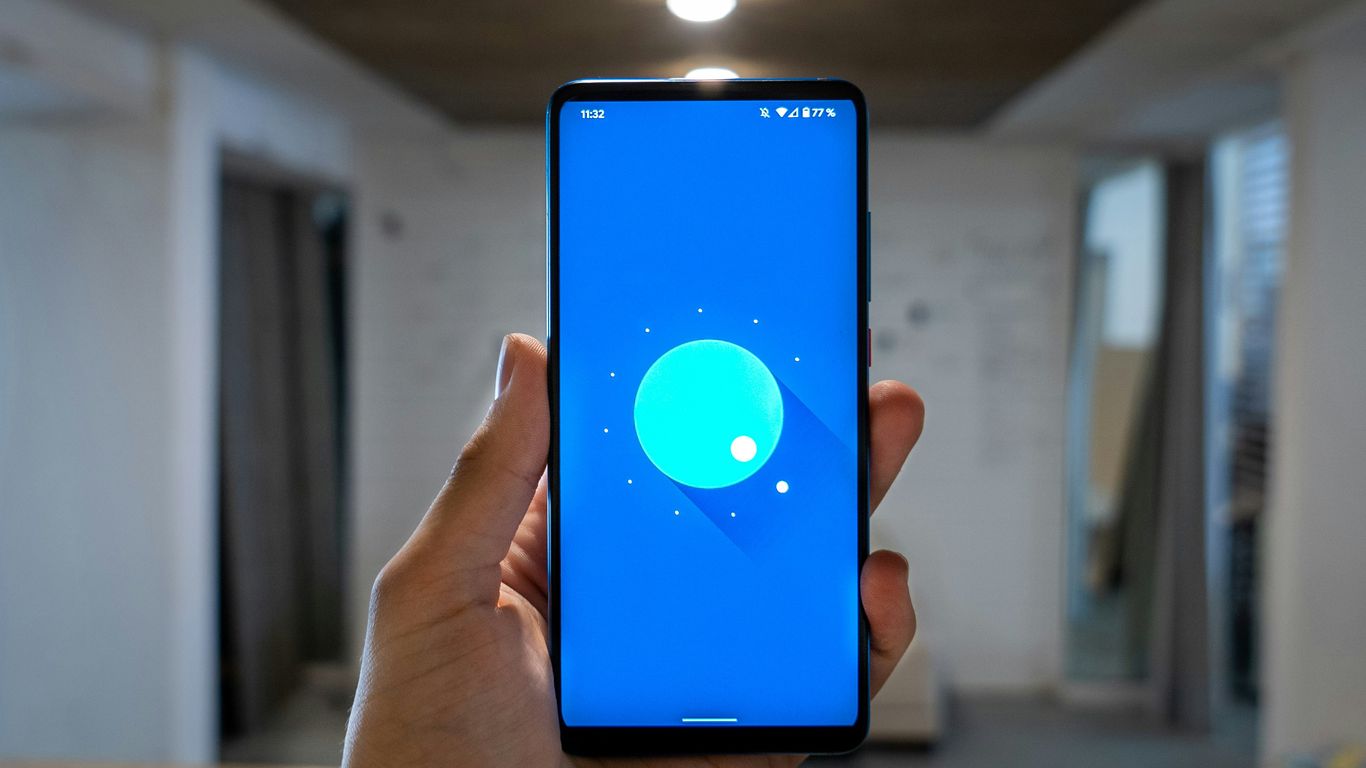 person holding blue ipod touch