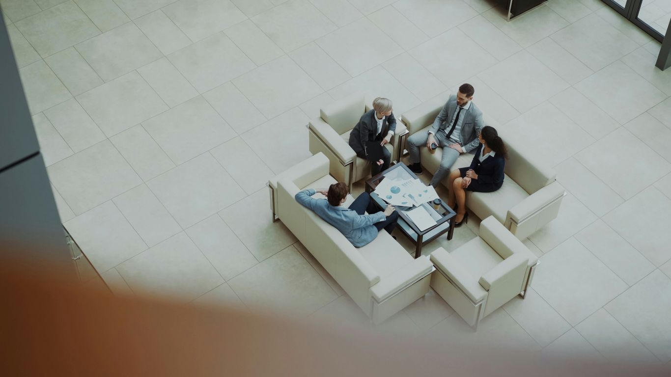 Business people meeting in a modern office lobby