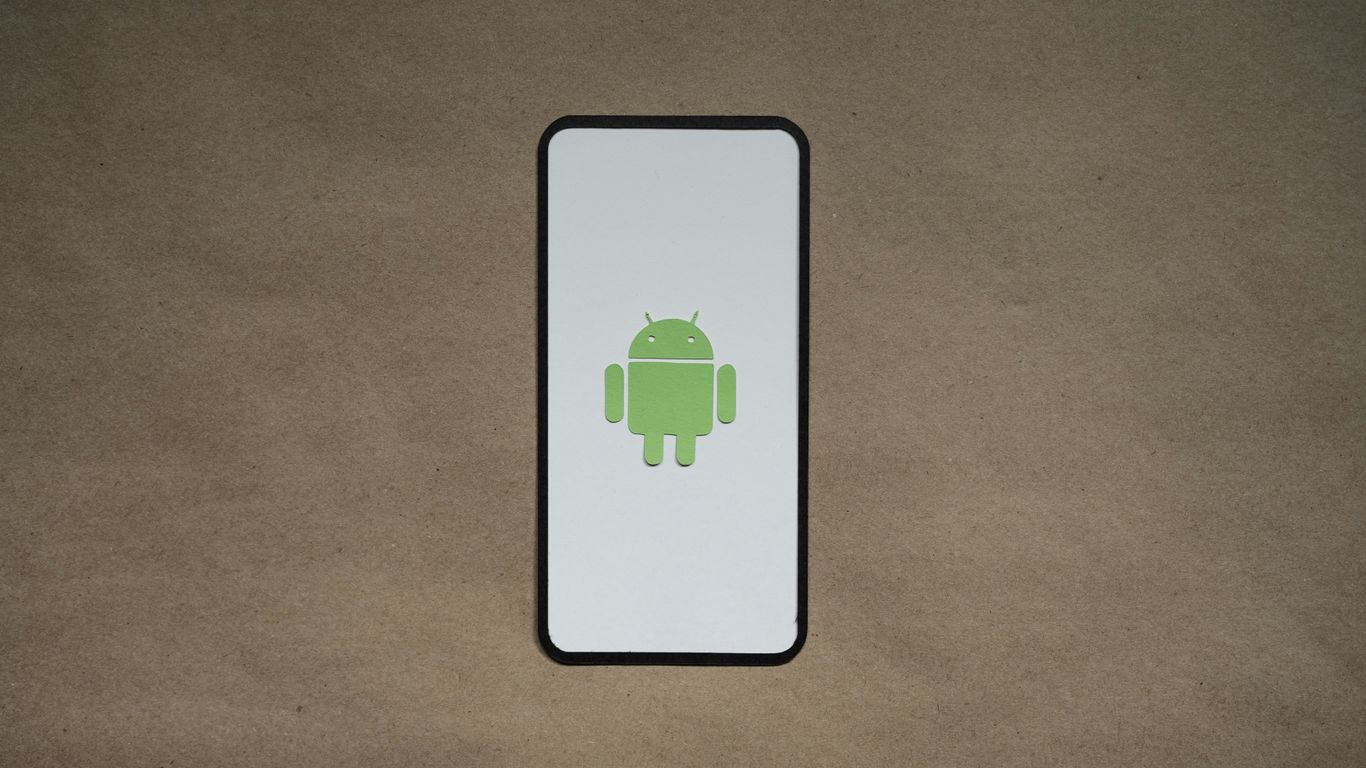 a cell phone with a green icon on it