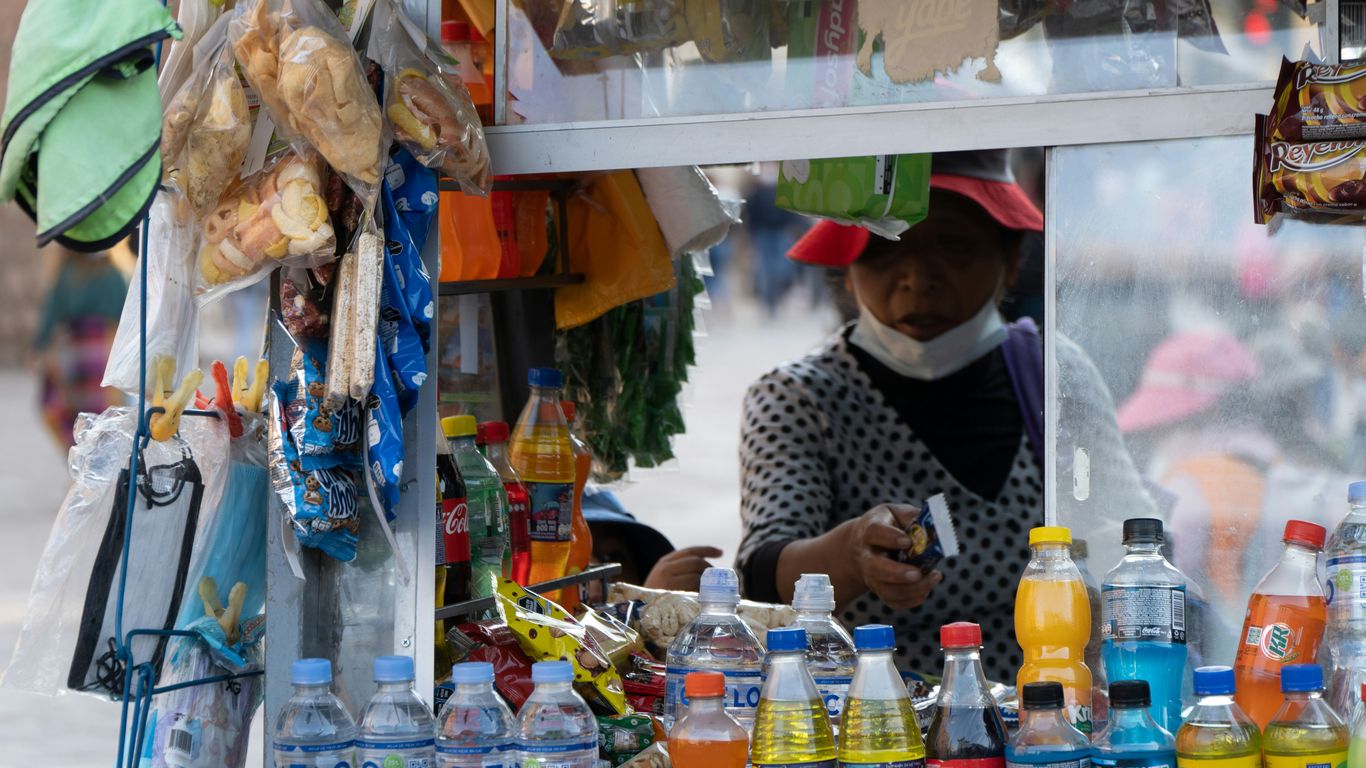 Street vendor with drinks and snacks for sale