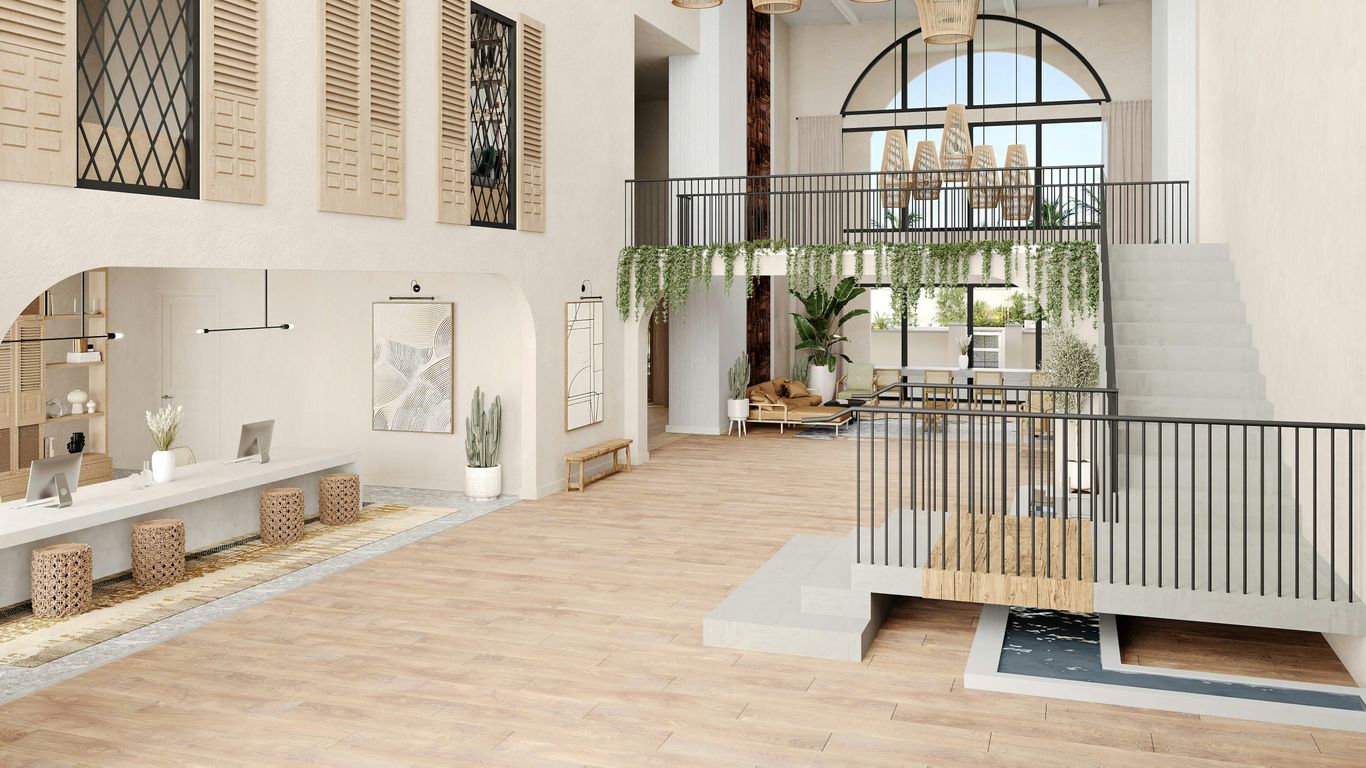 A bright and modern interior with a high ceiling.