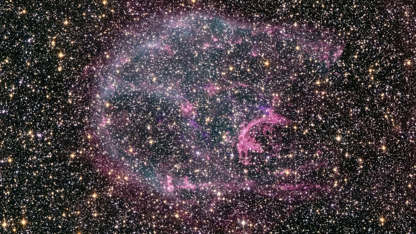a very large star surrounded by stars in the sky