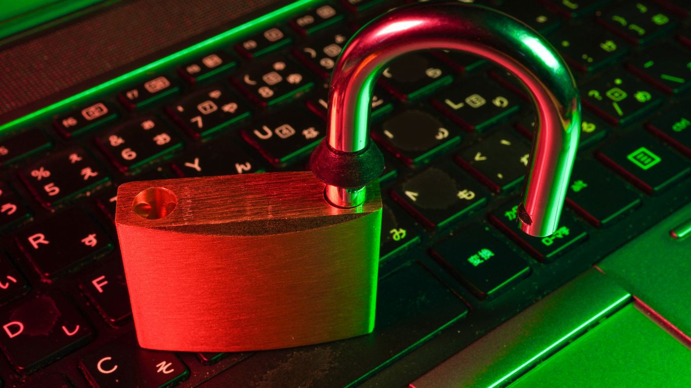 red padlock on black computer keyboard