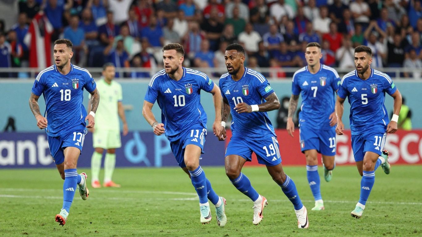 Italian football team playing on a green pitch.