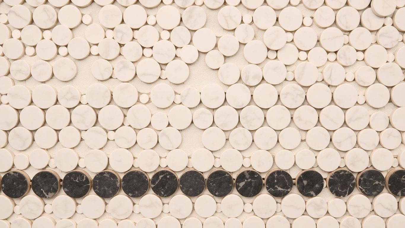 Penny round mosaic tiles in white and grey marble.