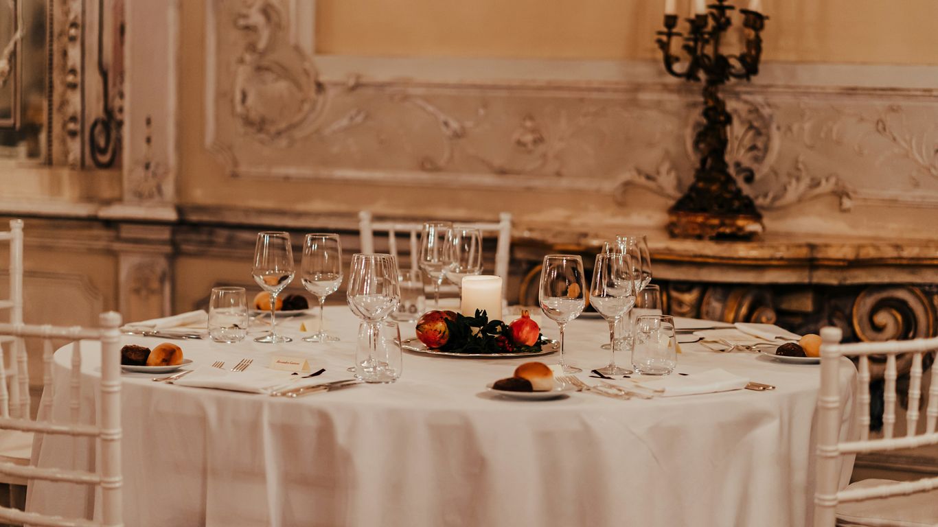 white table cloth with plates and glasses