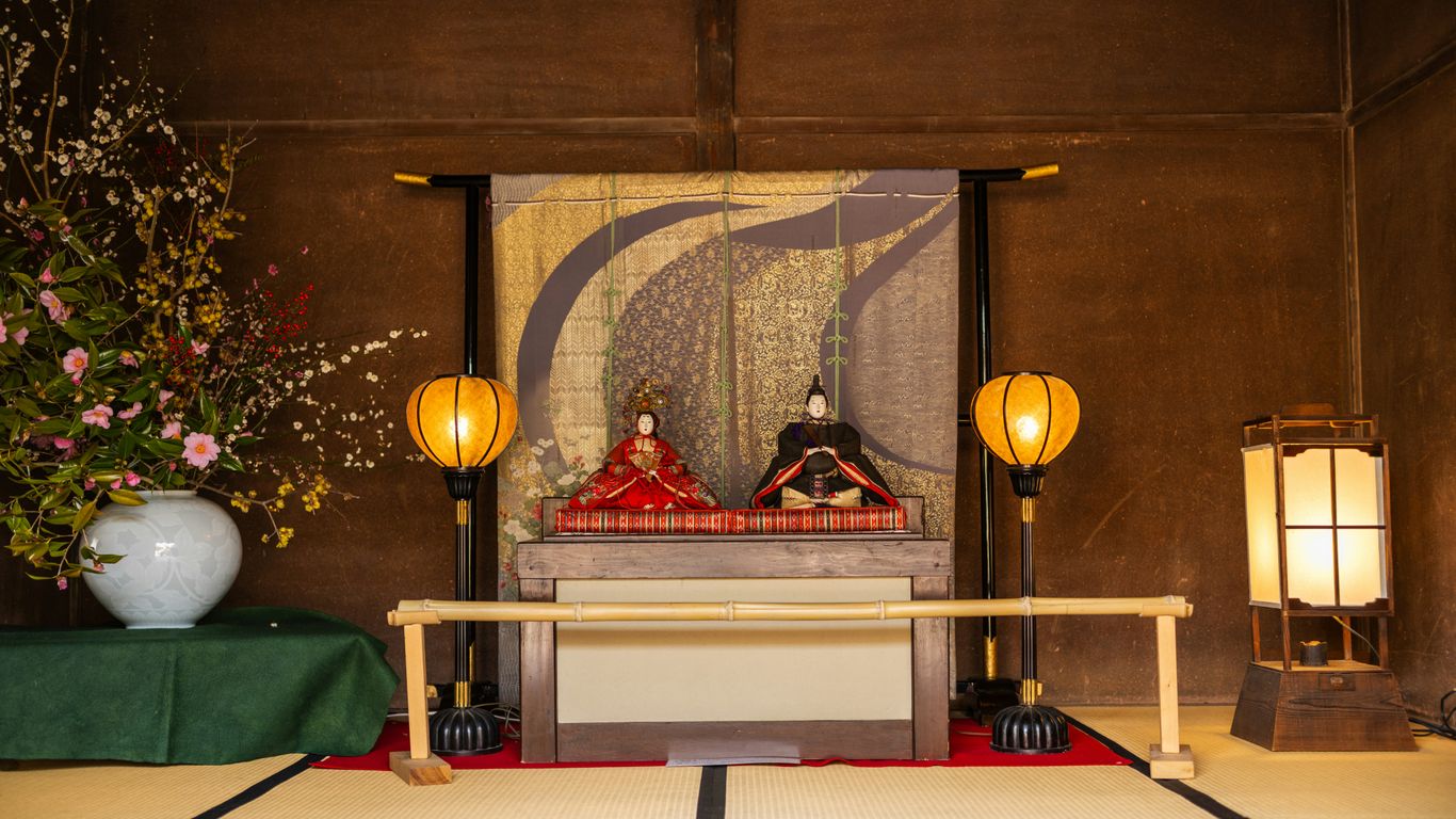 a room with a table and a painting on the wall