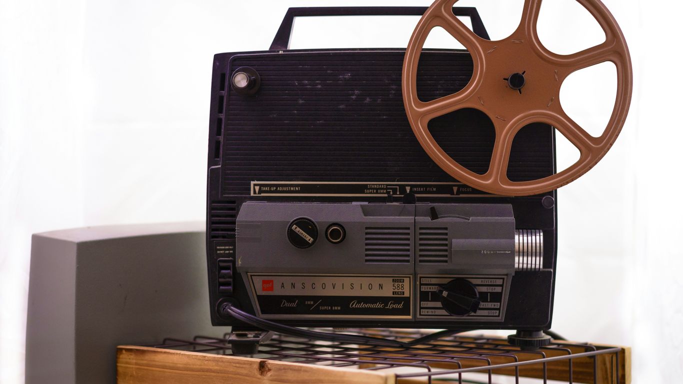 an old movie projector sitting on top of a table