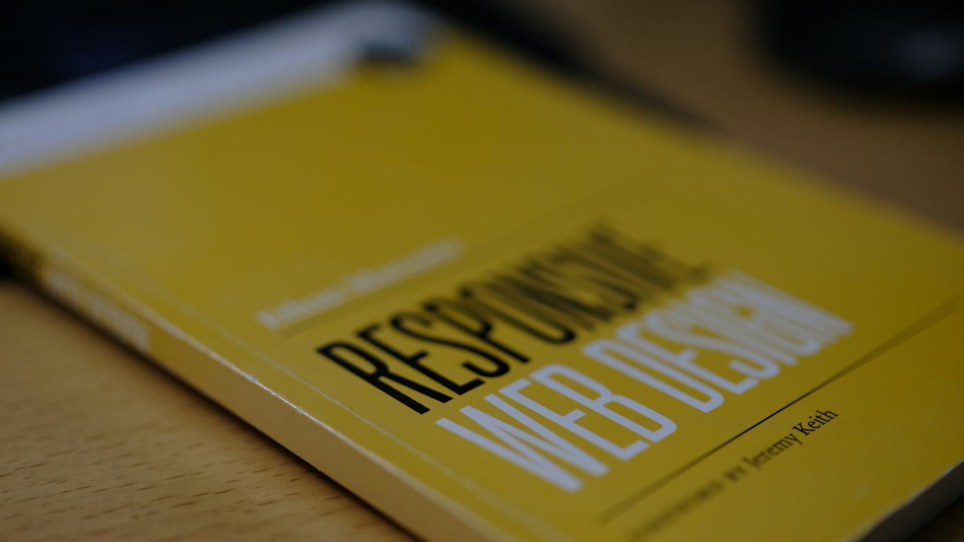 a yellow book sitting on top of a wooden table