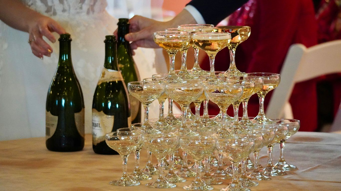 a table topped with lots of wine glasses