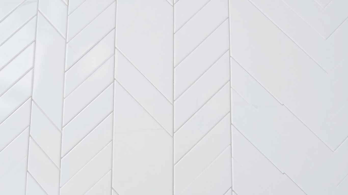 Large white herringbone mosaic tiles