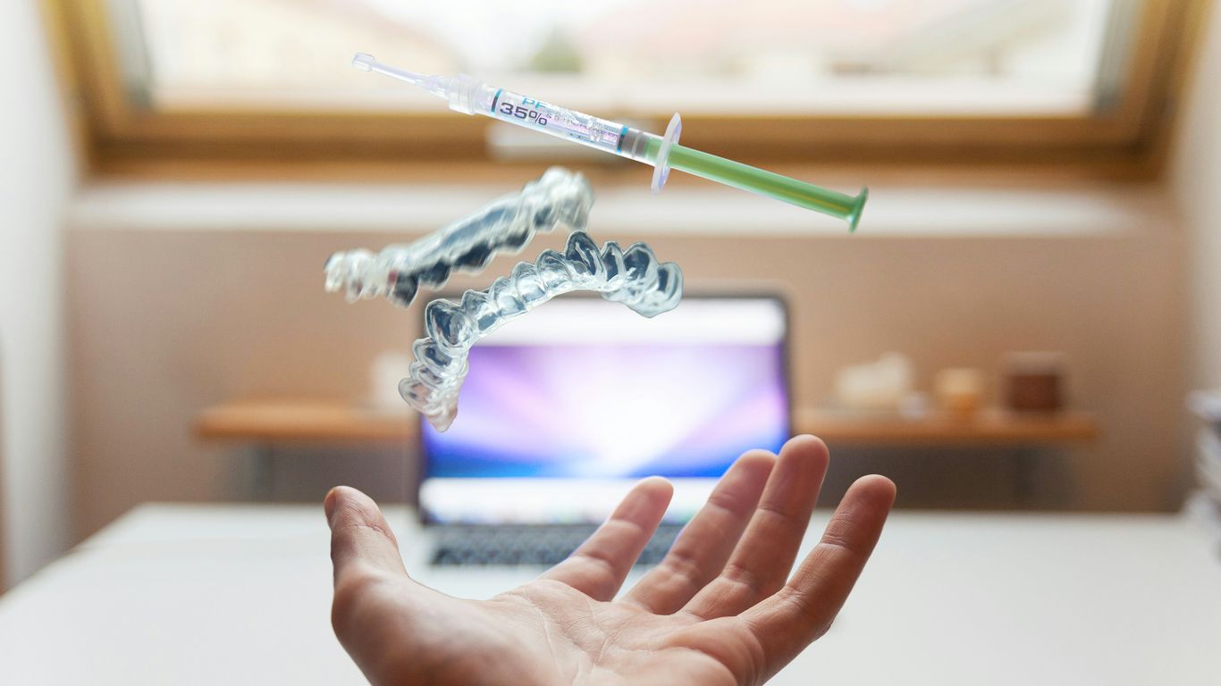 open palm with syringe floating above