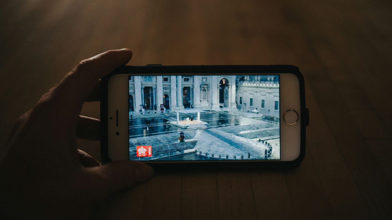 person holding silver iphone 6