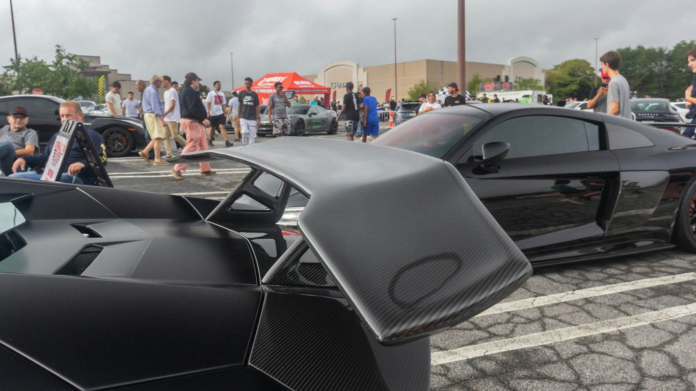 a bunch of cars parked in a parking lot