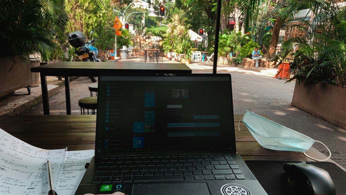 a laptop sits on a table