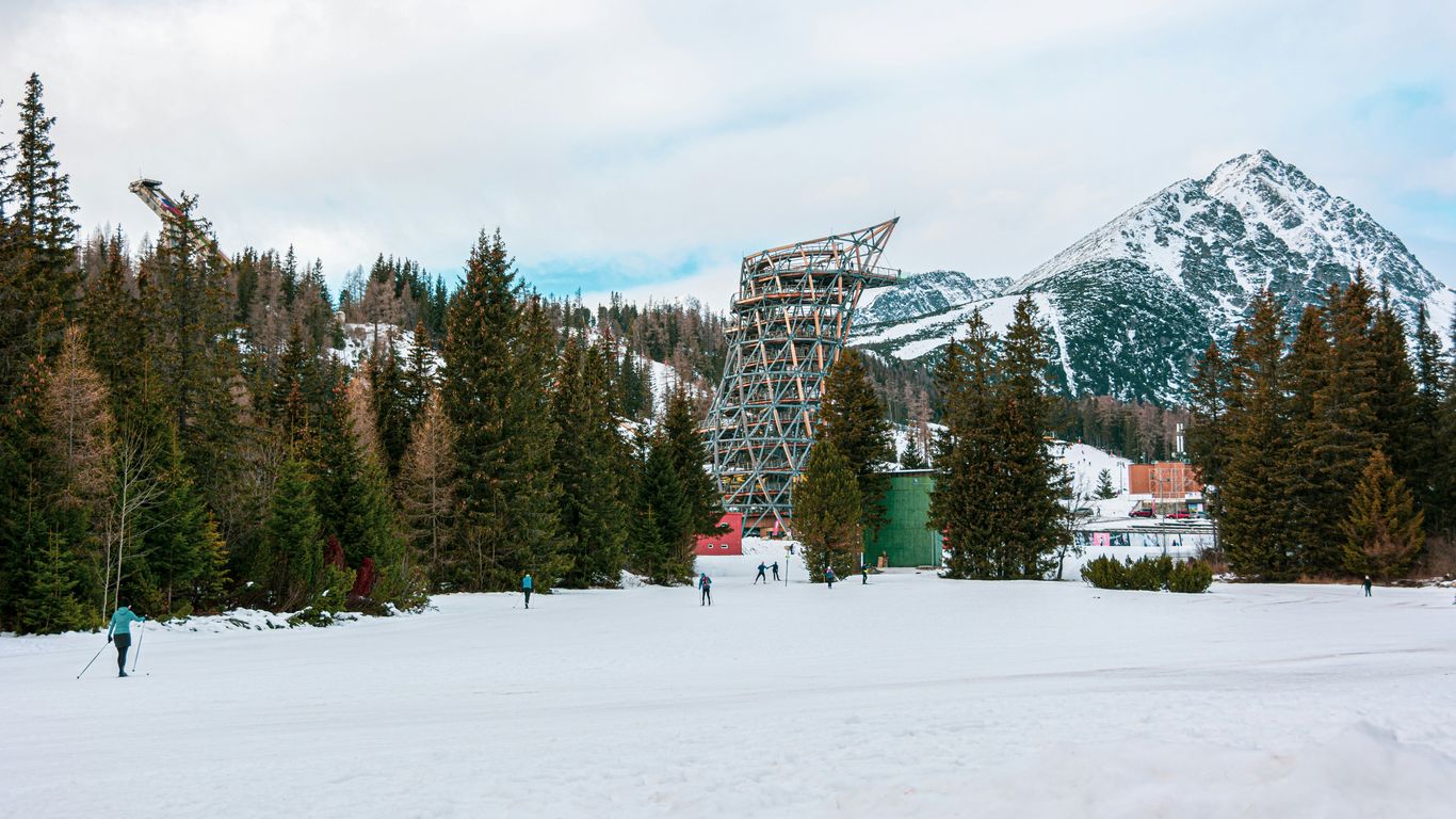 a ski resort with a mountain in the background