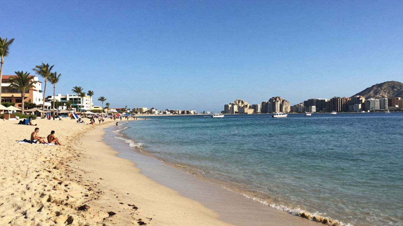 Cabo beach with calm waters and palm trees.