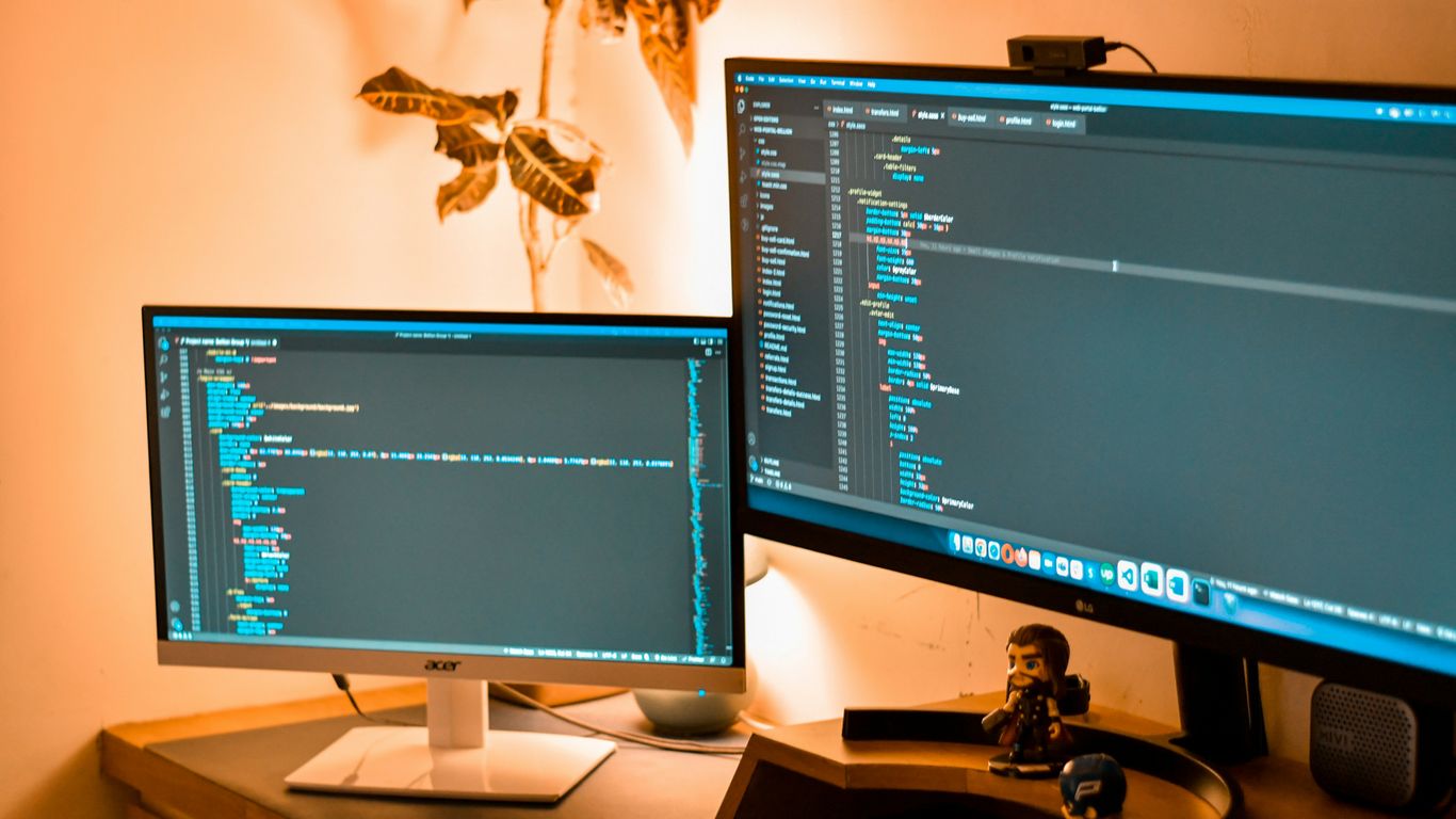 a couple of computer screens