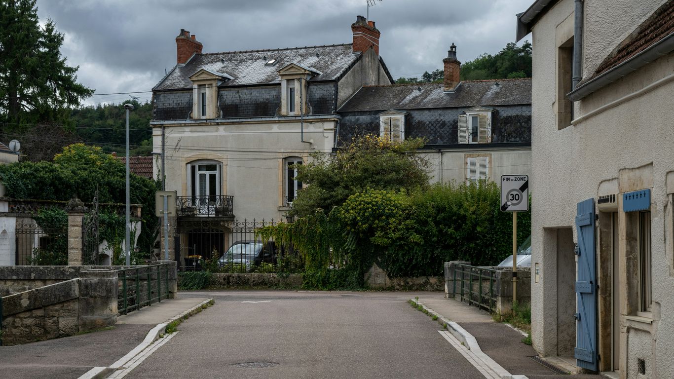 Street view of old buildings and lush greenery