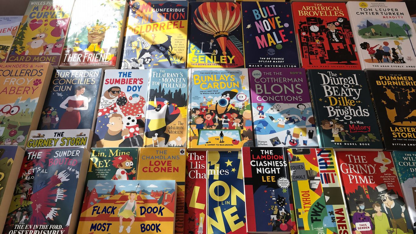 Collection of iconic book covers with sunlight glinting off spines.