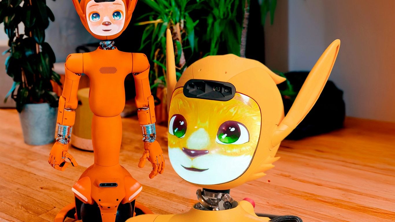 Two orange robots with animal-like features.