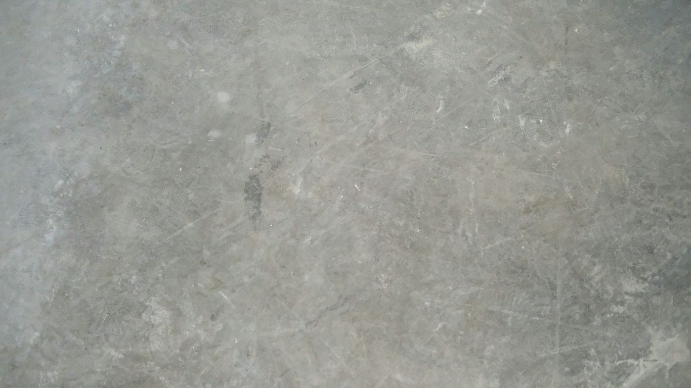 a close up view of a gray marble floor