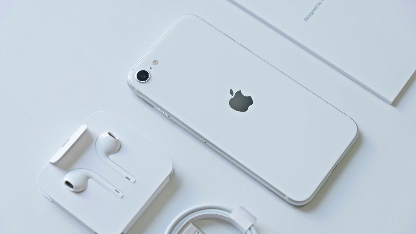 silver iphone 6 on white table