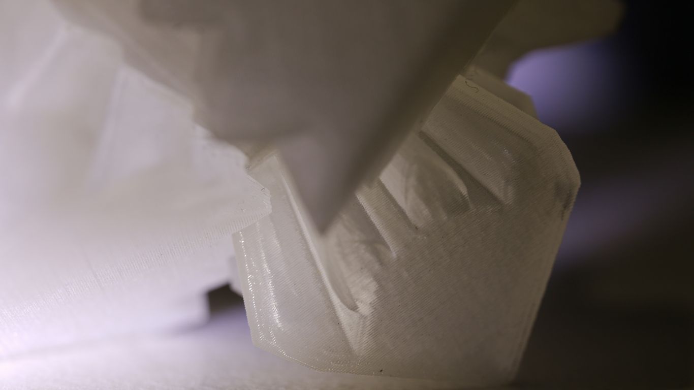 a close up of a white object on a table