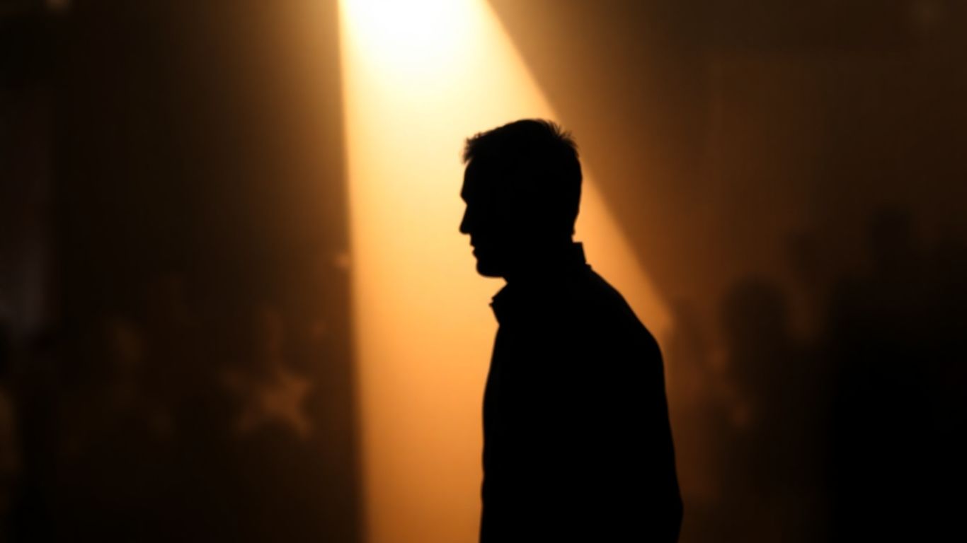 Shadowy figure moving towards a bright light.