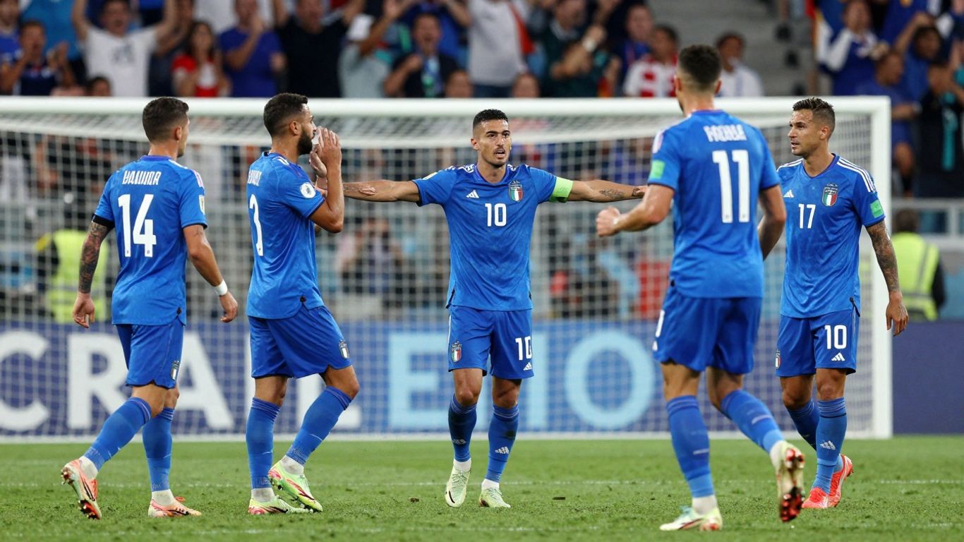 Italian football team celebrating a goal during a match.