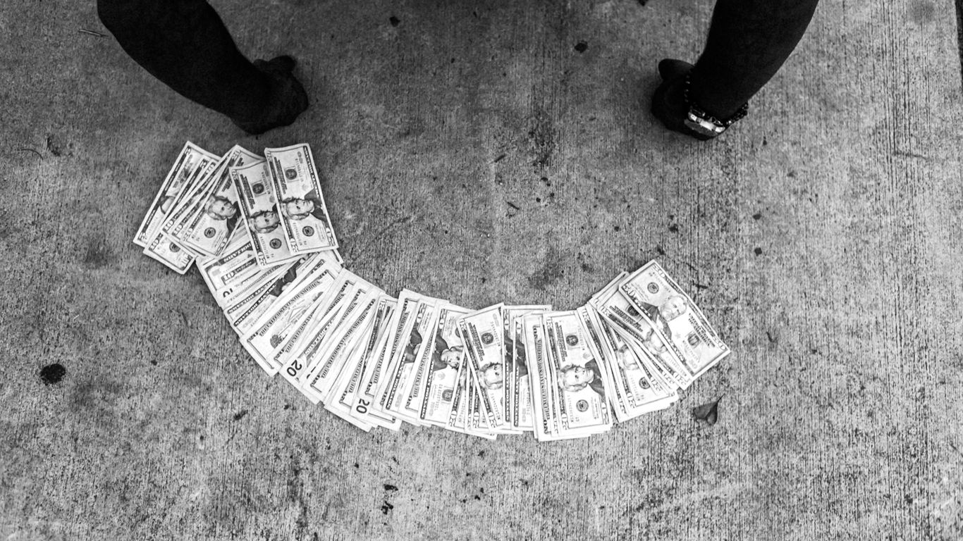 grayscale photo of person standing on concrete floor