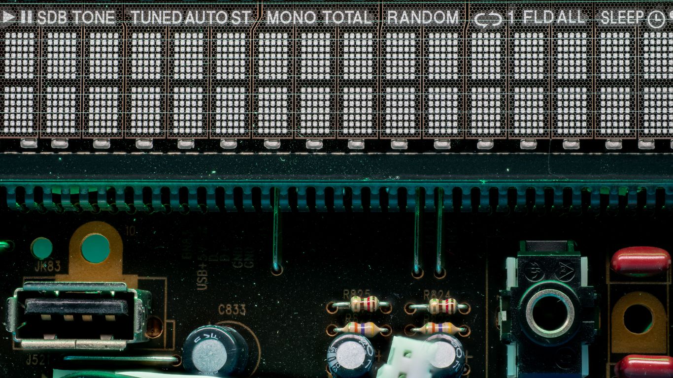 A digital display shows radio station and settings.