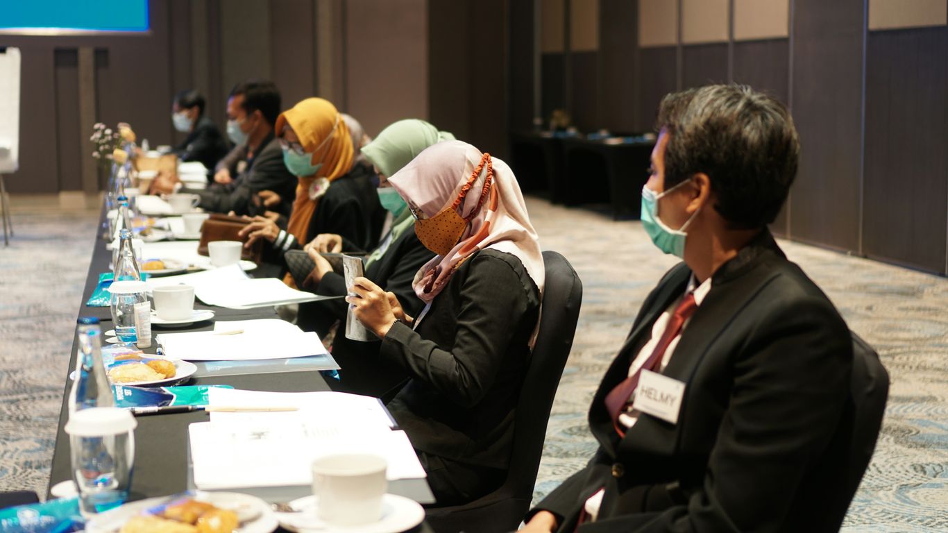 man in black jacket sitting beside woman in black jacket