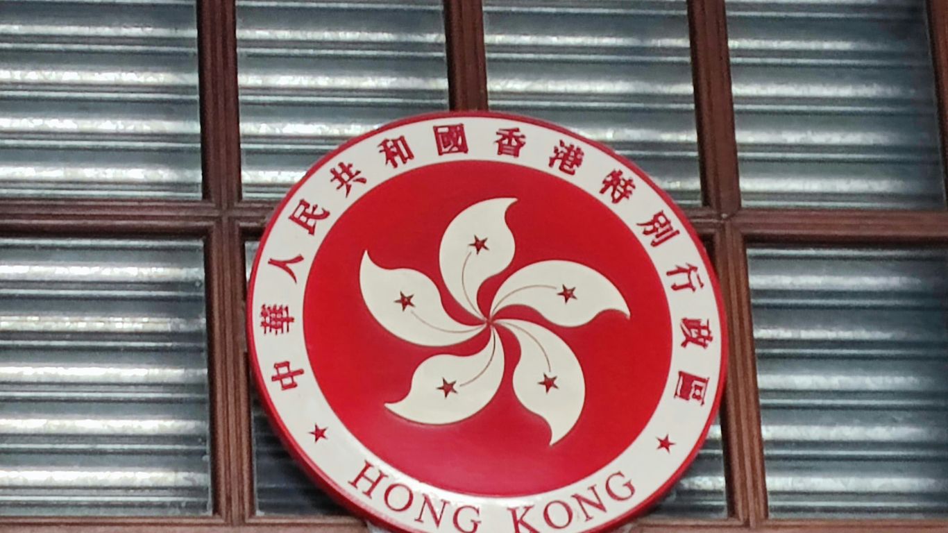 a round red and white sign with a cartoon character on it