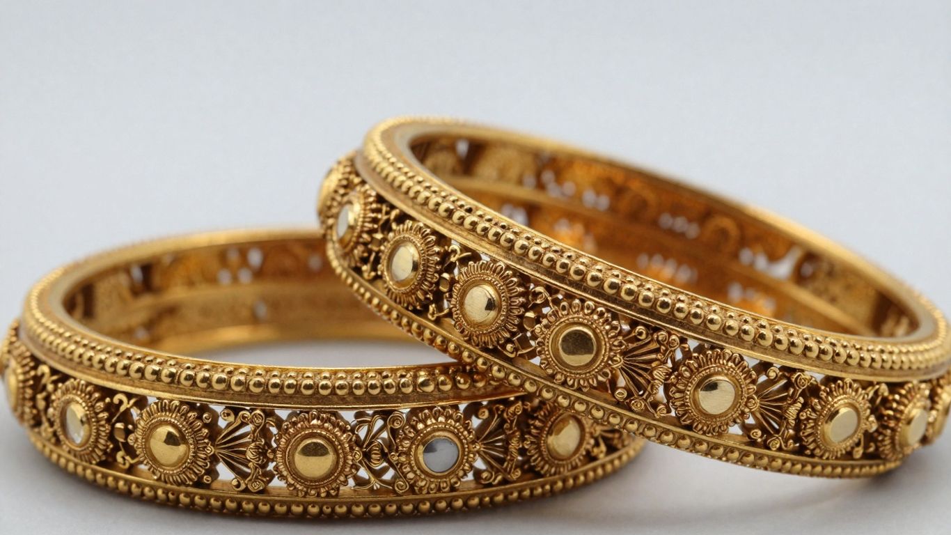 Intricate gold Nakshi bangles with detailed Indian artistry.