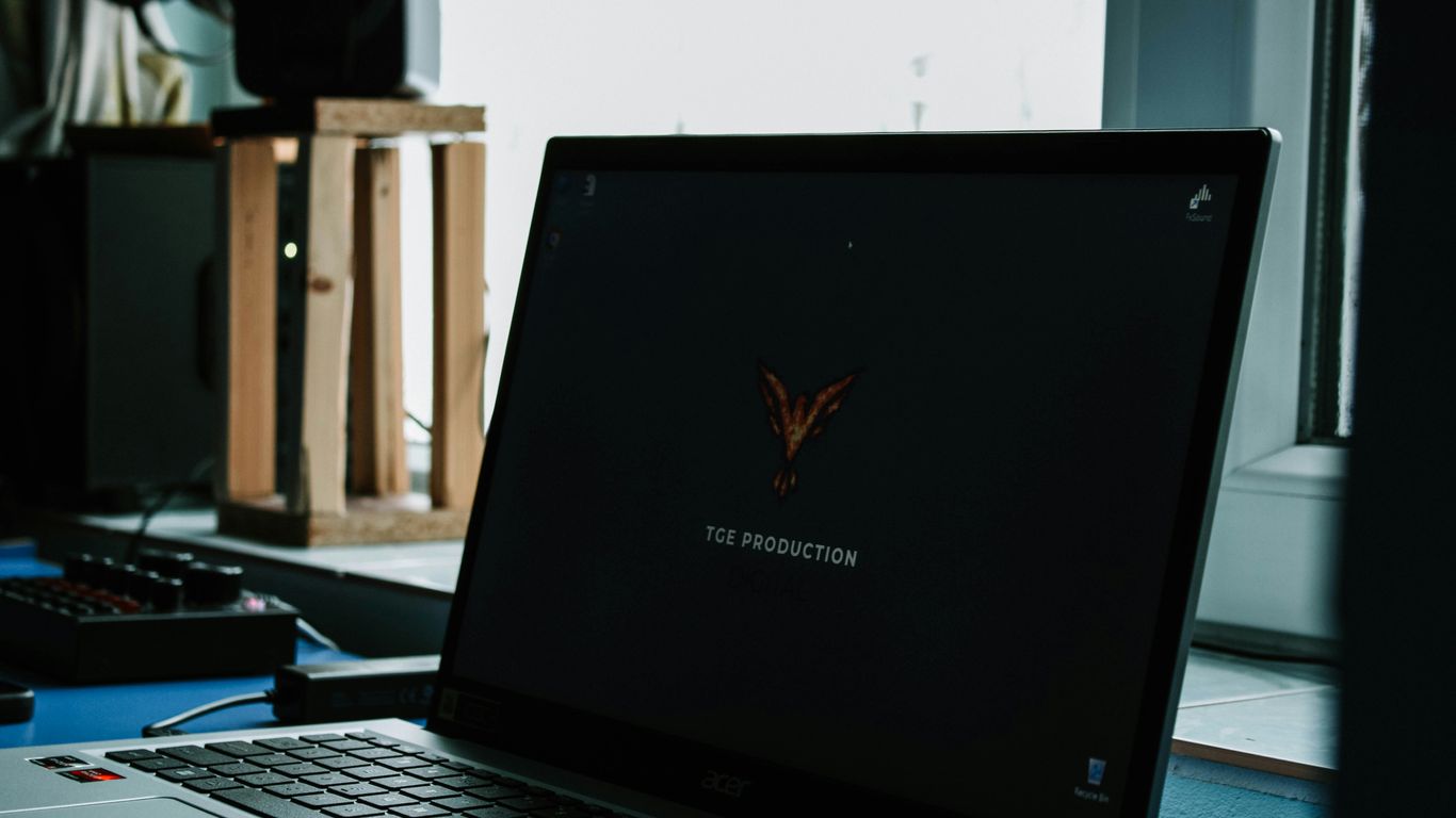 a laptop computer sitting on top of a desk