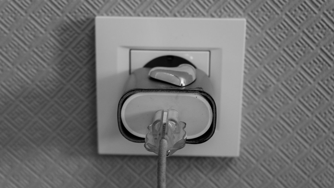 A plug inserted into a wall socket
