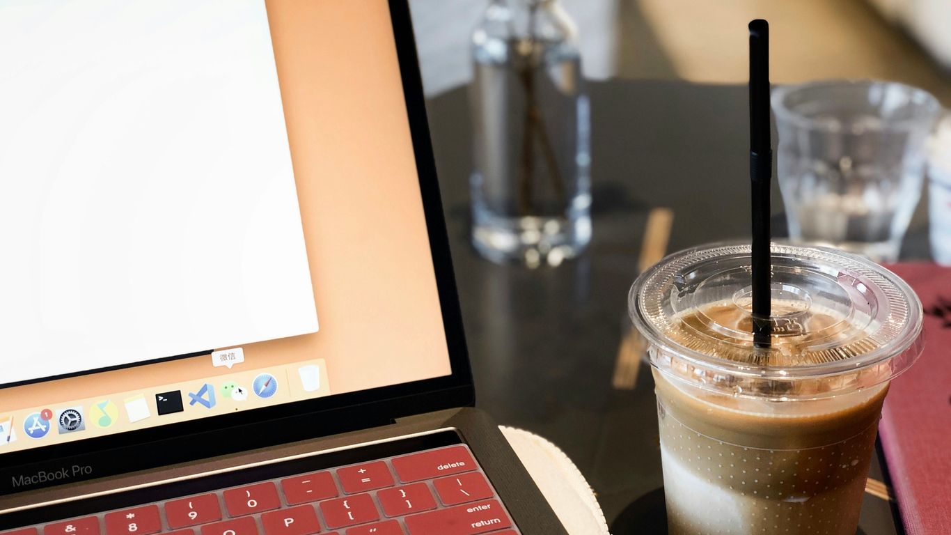 drink beside turned MacBook Pro