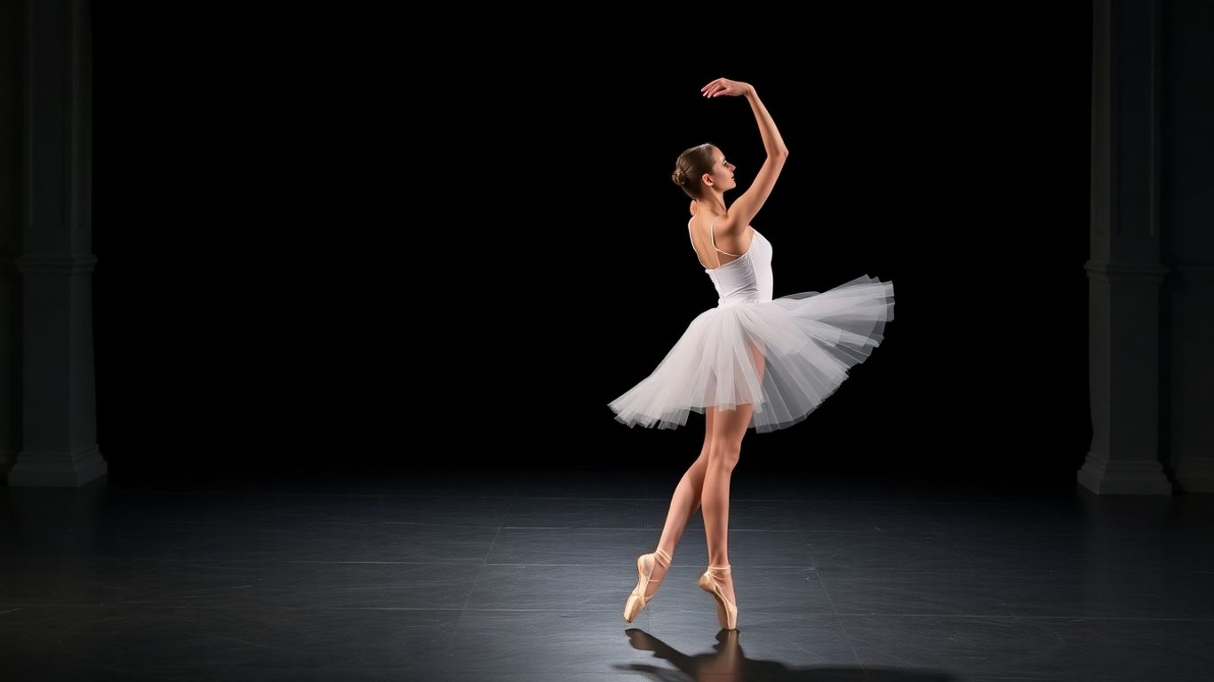 Ballerina in white tutu performing on stage.