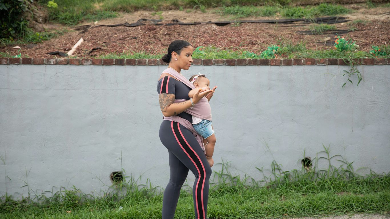 a person holding a baby