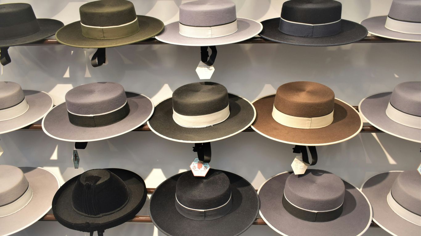 a rack of hats on display in a store