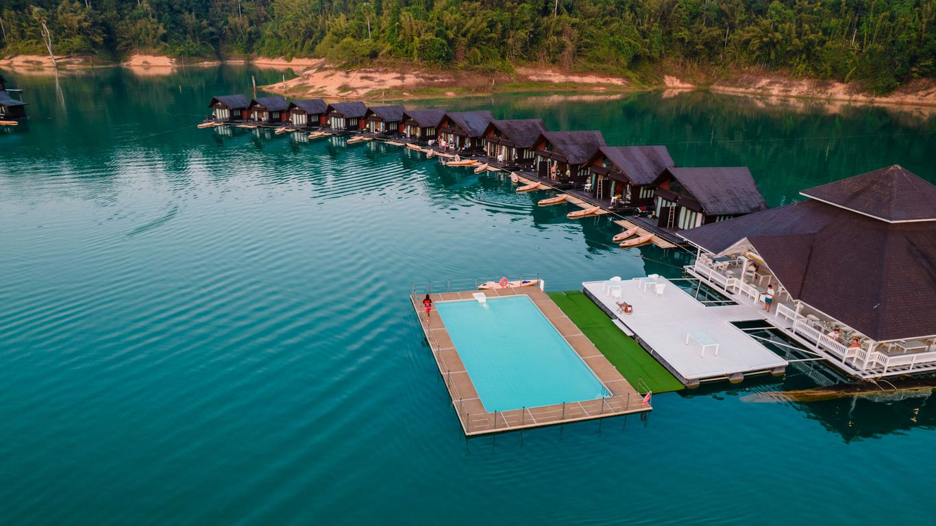 An aerial view of a resort on a lake