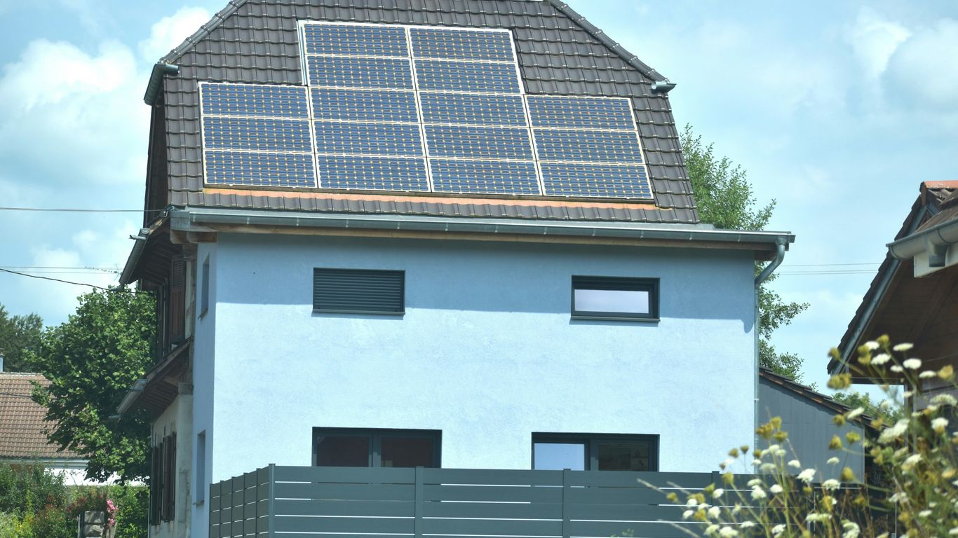 A house with a solar panel on the roof