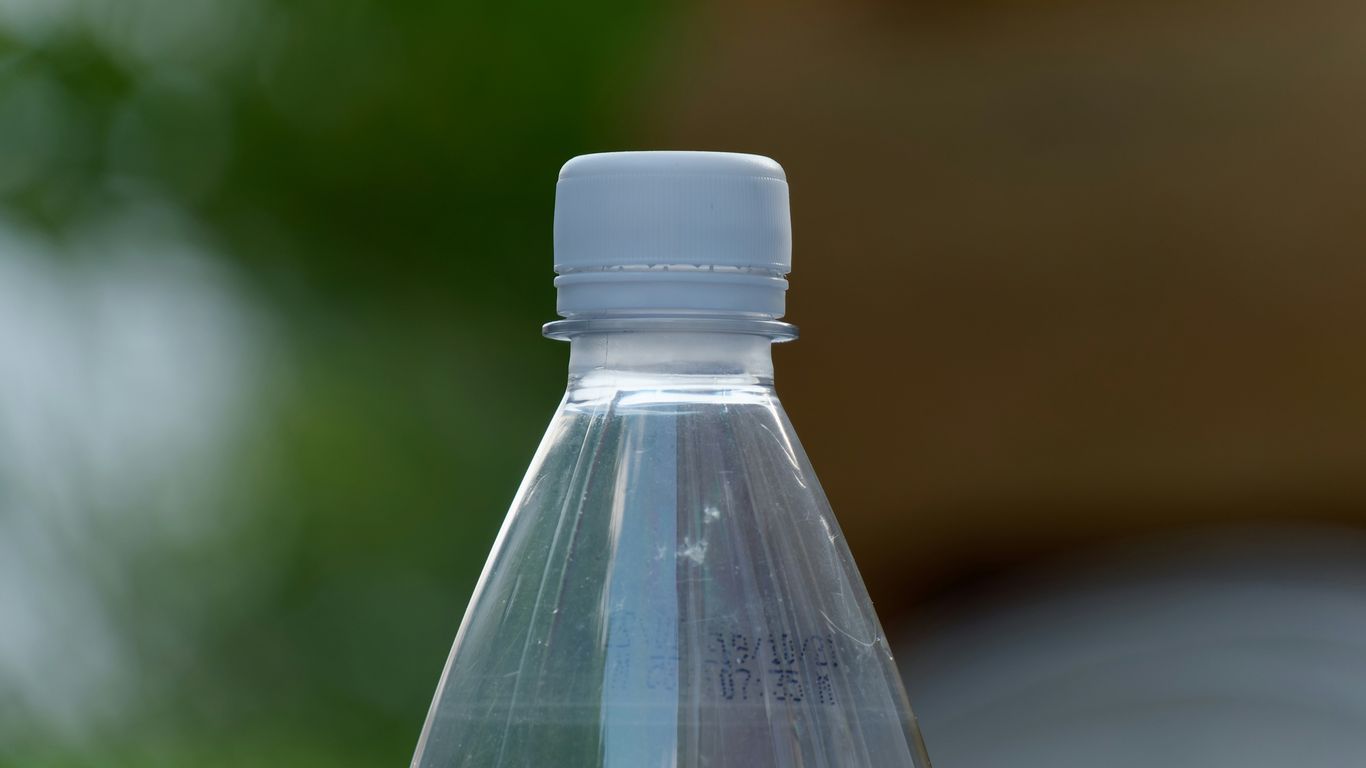 a close up of a water bottle with a blurry background