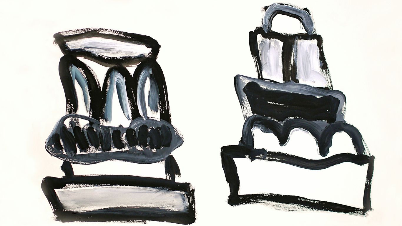 Two abstract cakes with black icing details.