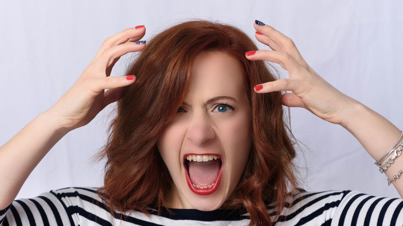 smiling girl in black and white striped shirt