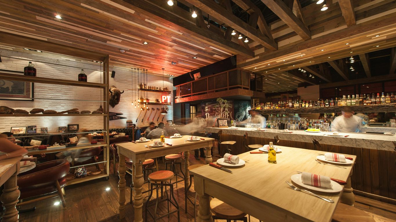 brown wooden table and chairs in a restaurant